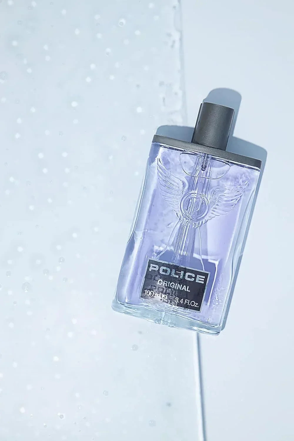Police Original Eau de Toilette 100ml fragrance bottle with winged emblem on light background