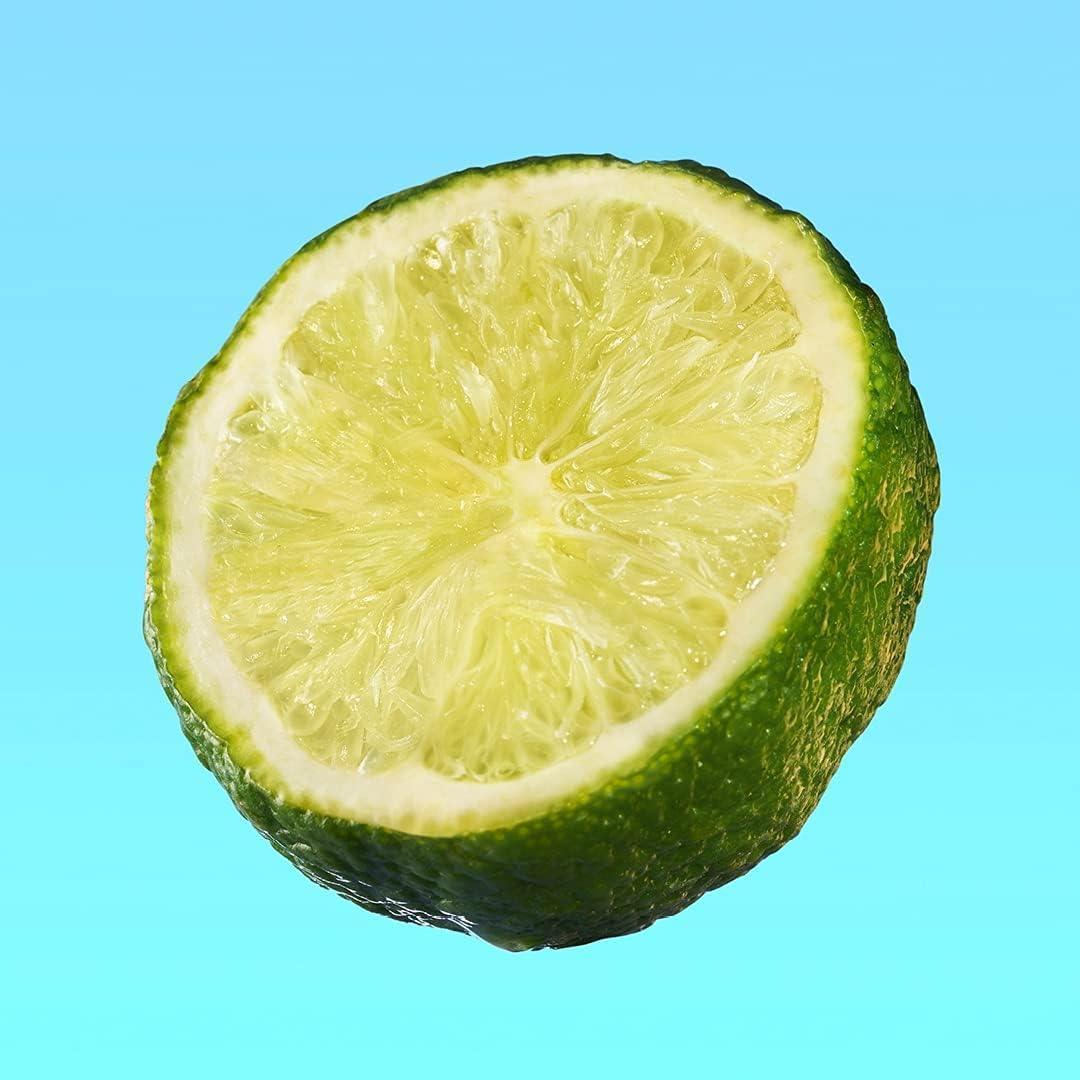 Freshly cut lime half on bright blue background