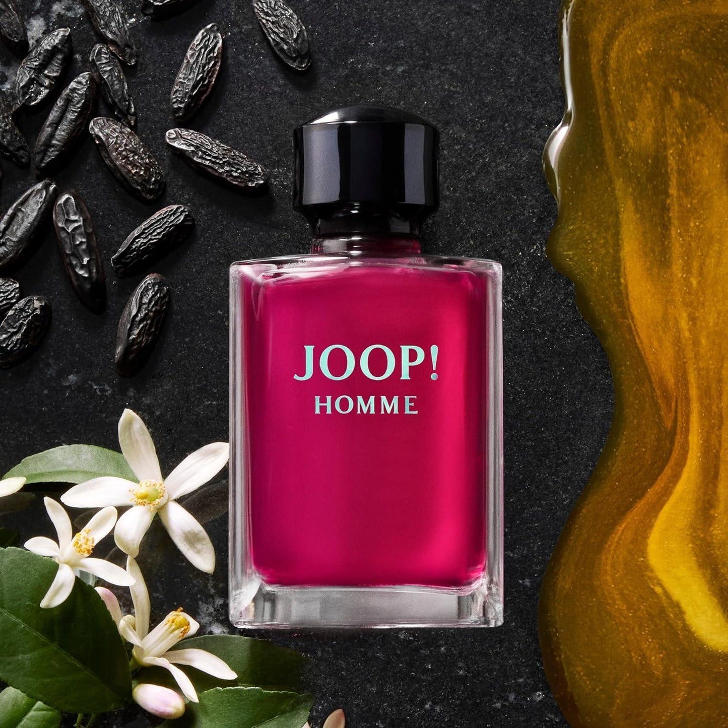 JOOP! Homme Eau de Toilette fragrance bottle with orange blossoms and dark seeds