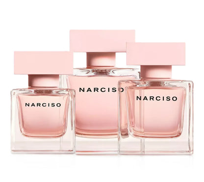 Three Narciso perfume bottles in clear glass with pale pink liquid and matching pink rectangular caps, arranged together on a white background.