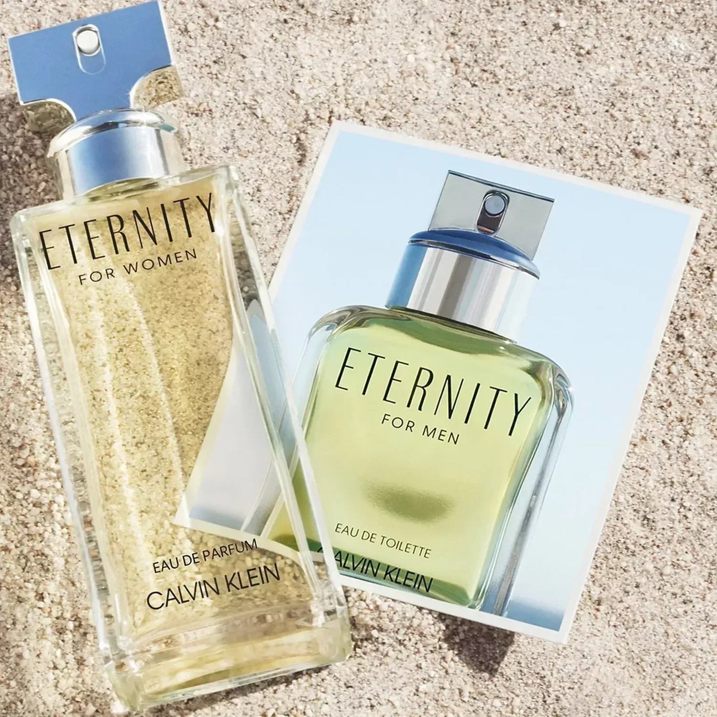 Calvin Klein Eternity for Women Eau de Parfum bottle with retail box on sand