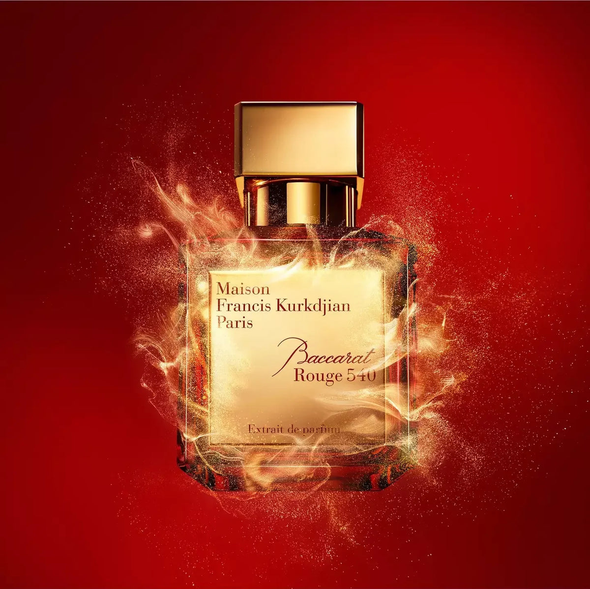 Perfume bottle with gold cap on a red background