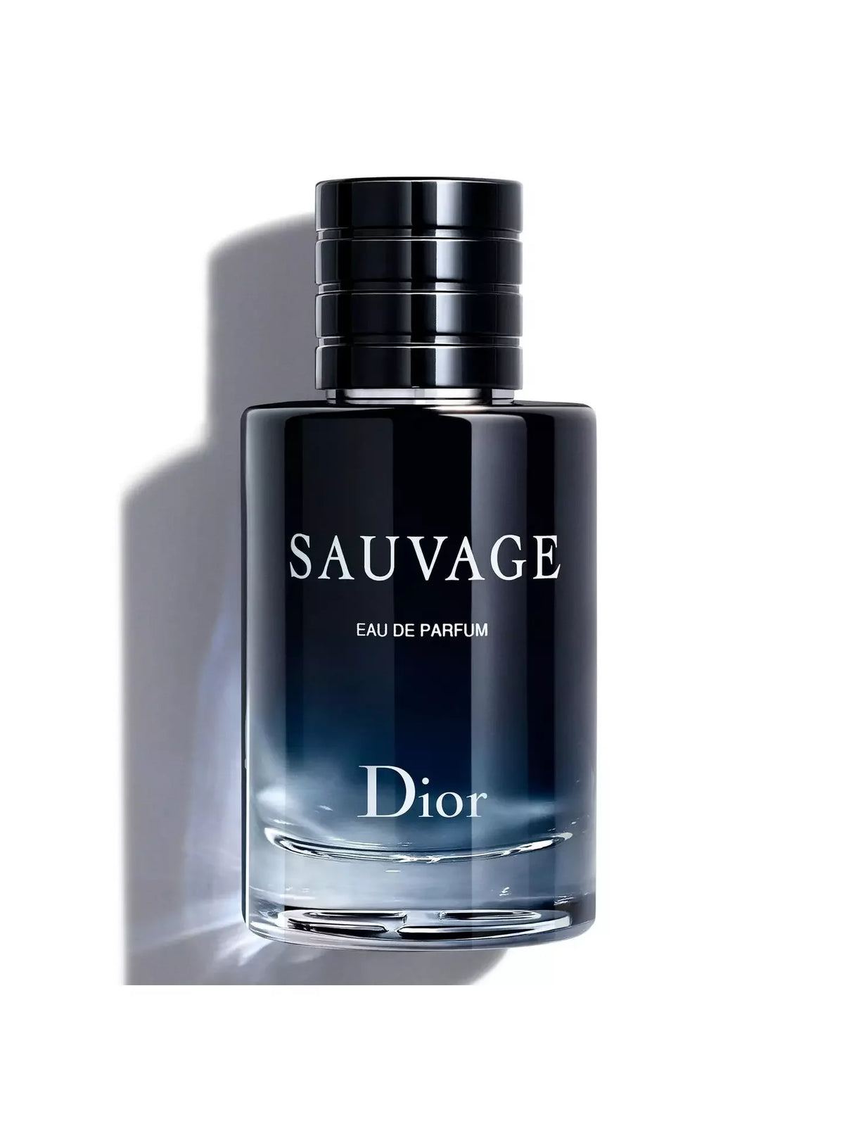 Dior Sauvage Eau de Parfum bottle, featuring a dark navy blue gradient glass bottle with a black cap, set against a clean white background with a soft shadow.