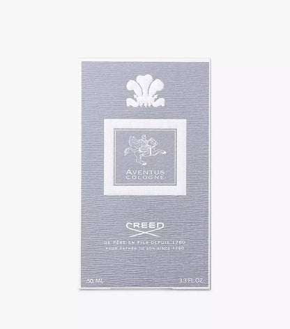 A Creed Aventus Cologne 50ml box packaging, featuring a textured light gray background with white printed details, including the iconic winged crest and the brand name 'Creed'. 50ml