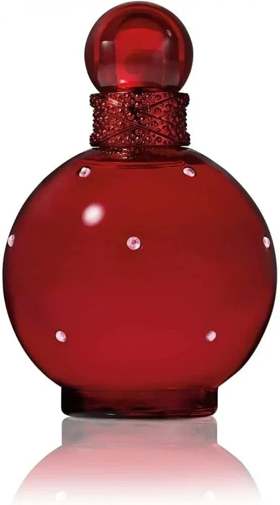Red round perfume bottle with gemstone accents and a decorative cap, luxury fragrance