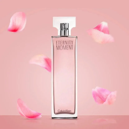Calvin Klein Eternity Moment Eau de Parfum bottle with pink rose petals 100ml