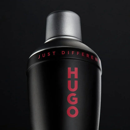 Black Hugo perfume bottle with red text on a black background