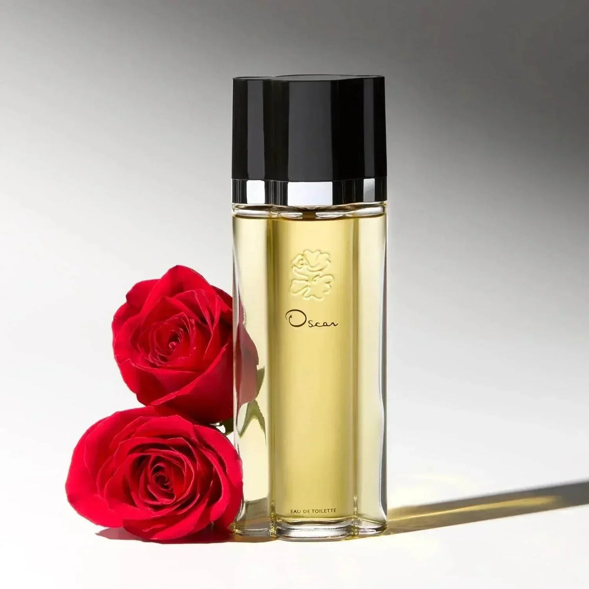 Oscar de la Renta Oscar Eau de Toilette fragrance bottle with red roses