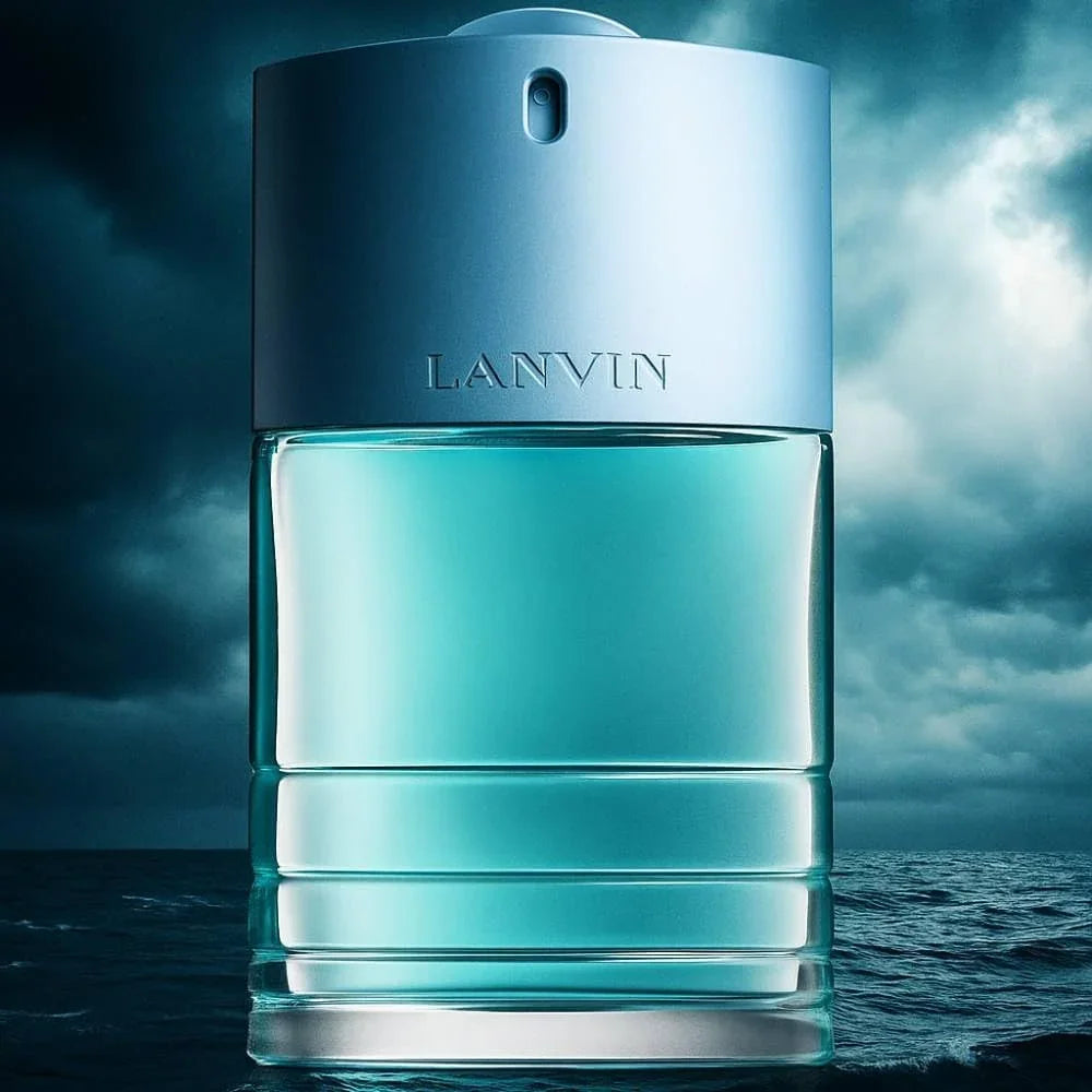 LANVIN Blue For Her cologne bottle, featuring a metallic blue cap and a clear glass body filled with light blue liquid, set against a dramatic stormy sea background.