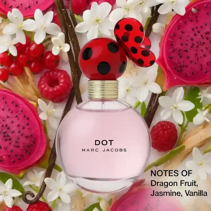 Marc Jacobs Dot perfume bottle with red and black cap, surrounded by dragon fruit, jasmine flowers, vanilla, and raspberries.
