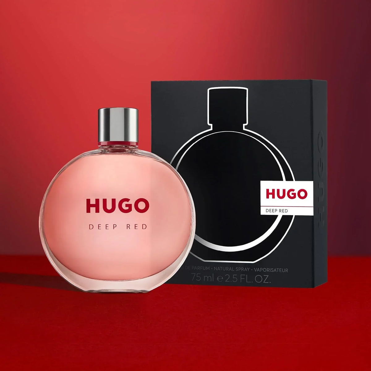 Hugo Deep Red perfume bottle and packaging on a red background