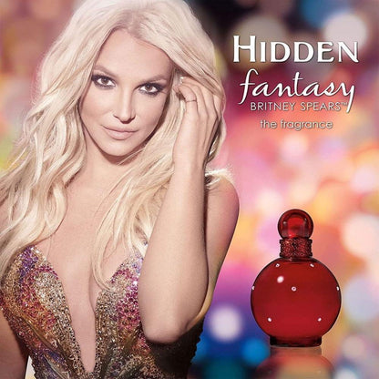 Hidden Fantasy perfume bottle in red with woman and colorful bokeh background