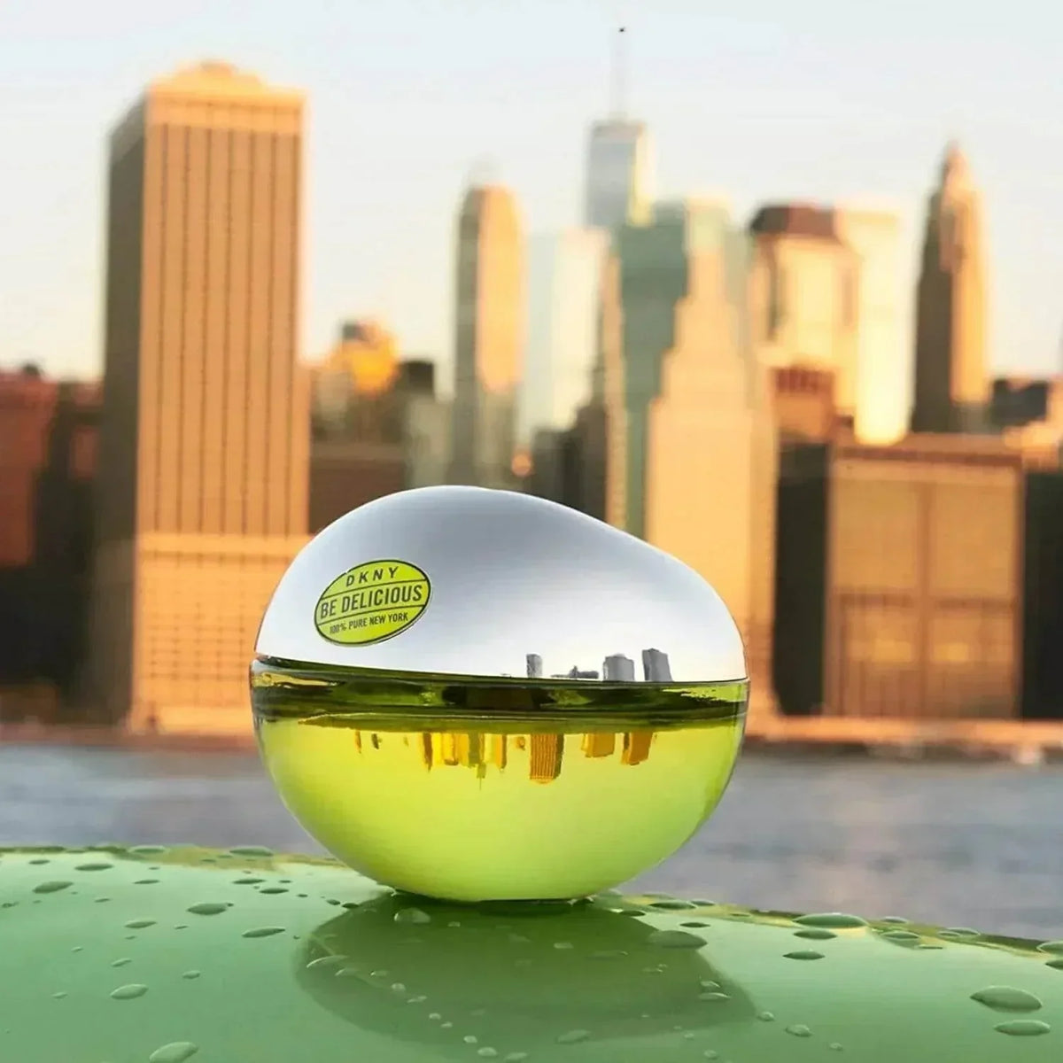DKNY Be Delicious Eau de Parfum 100ml fragrance bottle with NYC skyline reflection