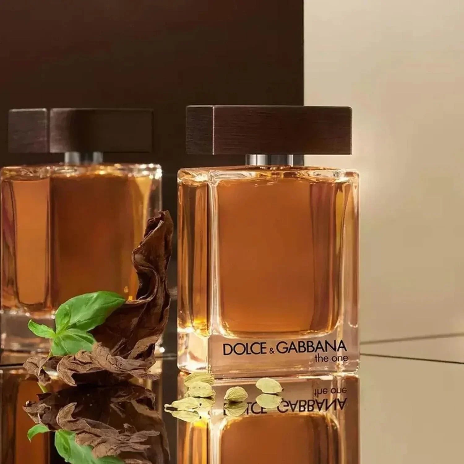 Dolce & Gabbana The One Eau de Parfum bottle with tobacco leaf and basil garnish