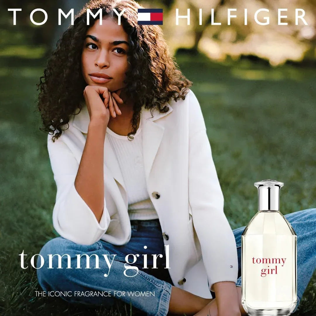 Tommy Hilfiger Tommy Girl Eau de Toilette fragrance bottle with model outdoors