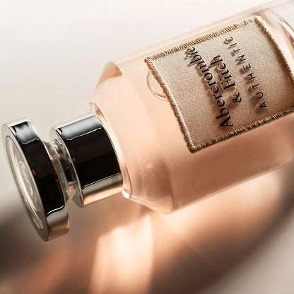Perfume bottle with Abercrombie & Fitch label on a light background