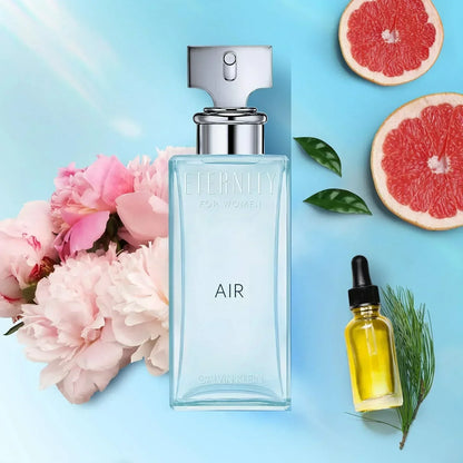 Calvin Klein Eternity Air for Women Eau de Parfum bottle with pink peonies and grapefruit slices