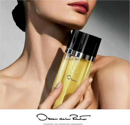 Oscar de la Renta Oscar Eau de Parfum 100ml fragrance bottle held by woman