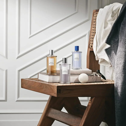 David Beckham Classic, Classic Homme, Classic Blue fragrance bottles on wooden stool with books