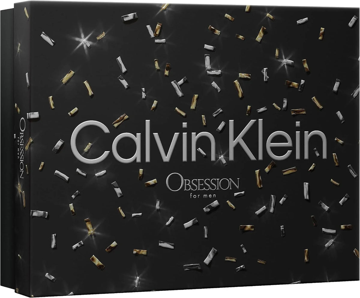 Calvin Klein Obsession for men fragrance box in black with silver and gold metallic confetti details and white text.