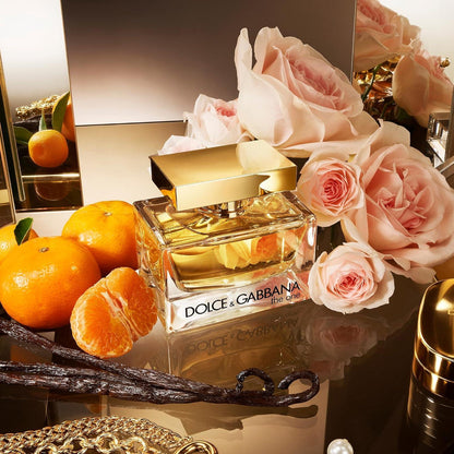 Dolce & Gabbana The One Eau de Parfum bottle with pink roses and oranges