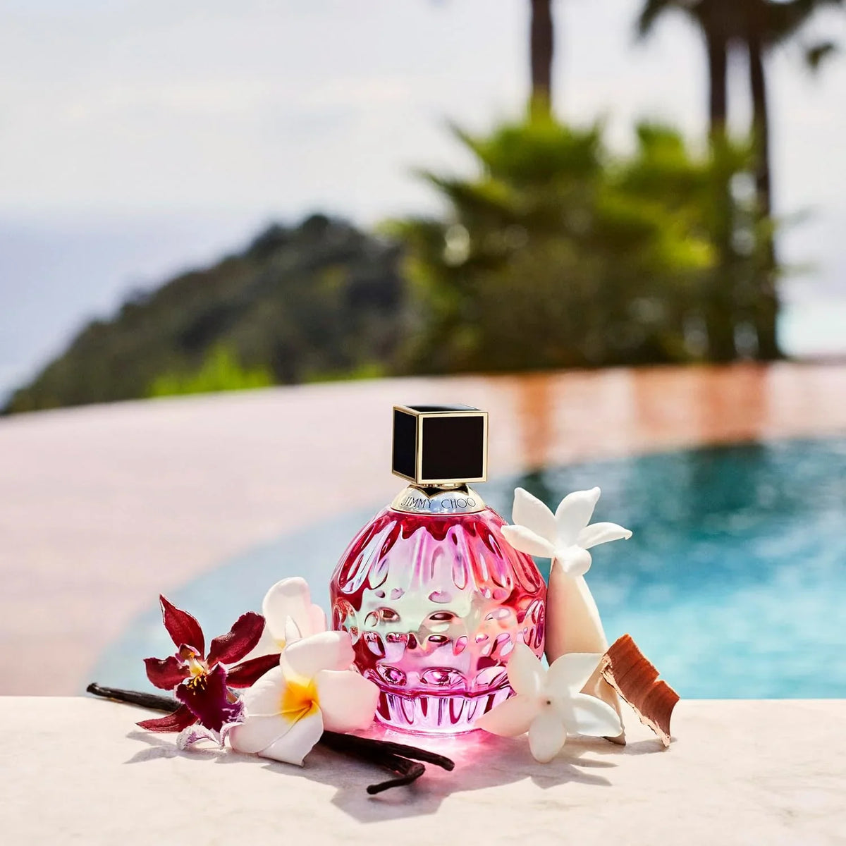 Pink perfume bottle with flowers on a poolside background 60ml, 100ml, 40ml