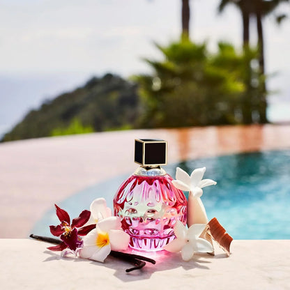 Pink perfume bottle with flowers on a poolside background 60ml, 100ml, 40ml