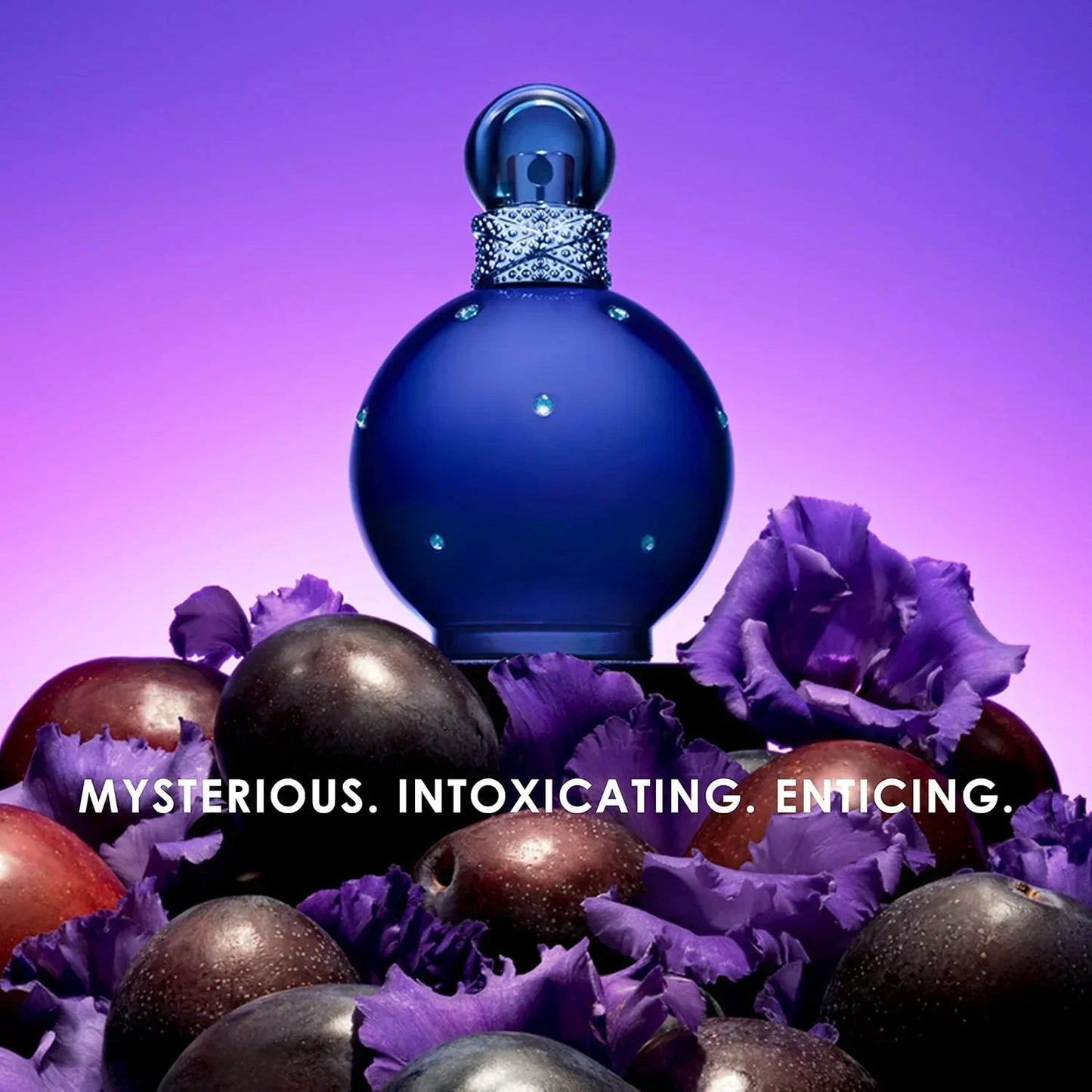 Paris Hilton Midnight Fantasy Eau de Parfum bottle with purple plums and flowers