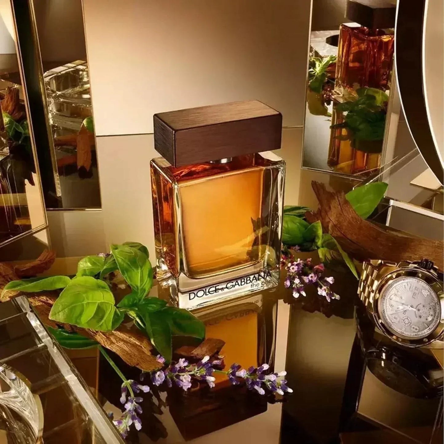 Dolce & Gabbana The One Eau de Parfum bottle with retail box, green leaves and purple flowers