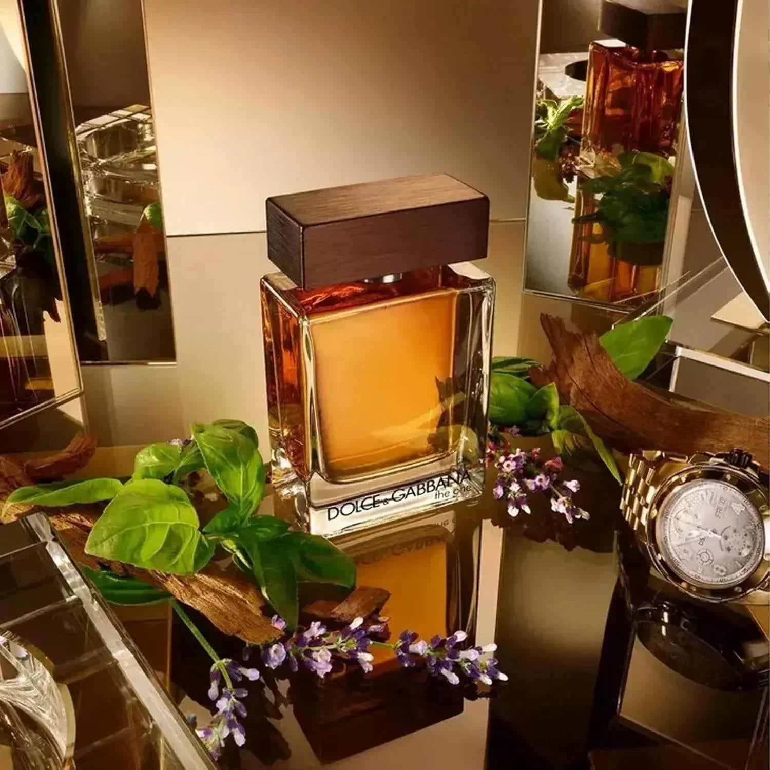 Dolce & Gabbana The One Eau de Parfum bottle with retail box, green leaves and purple flowers