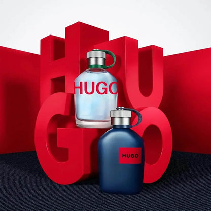 HUGO BOSS HUGO Man Eau de Toilette fragrance bottles with red lettering backdrop