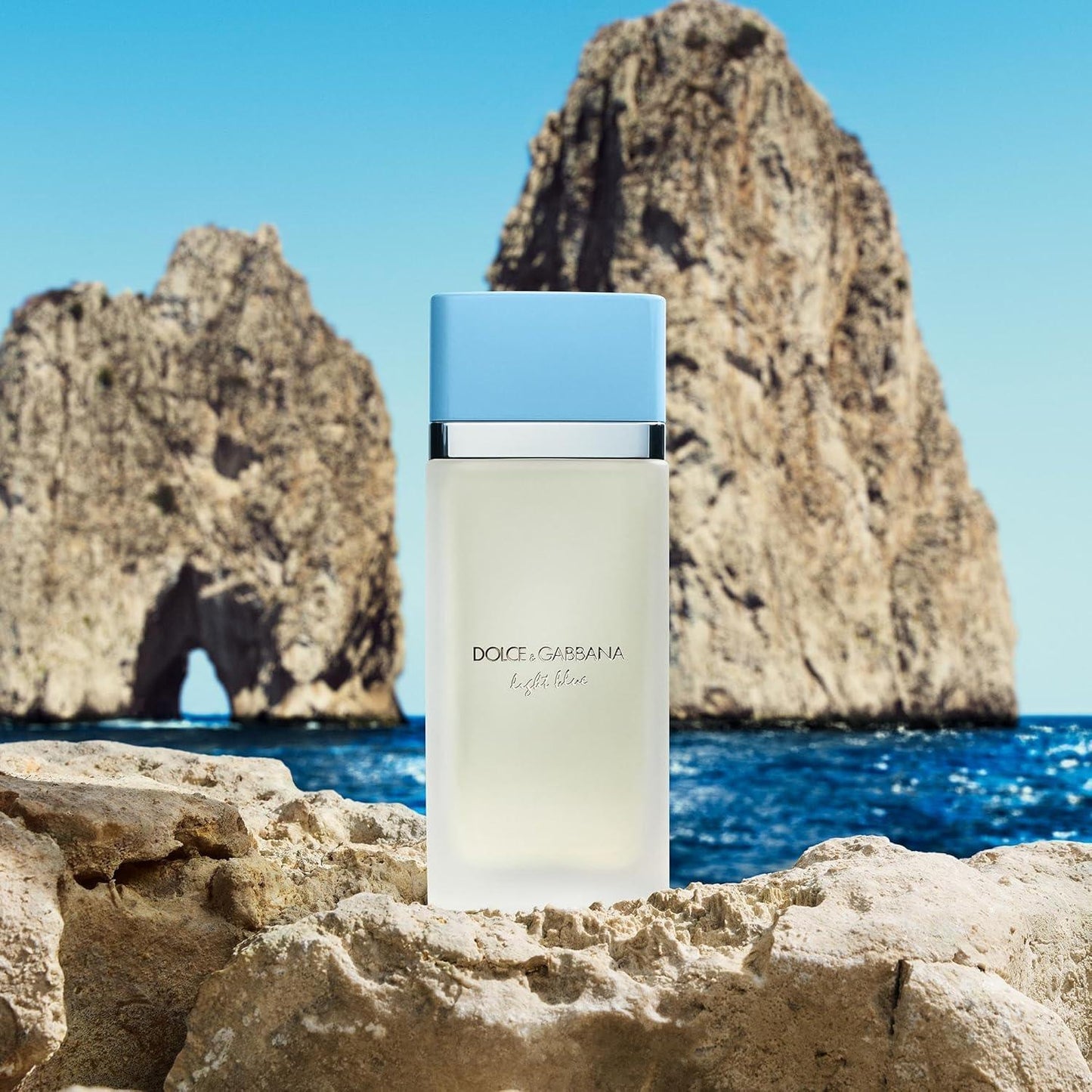 Dolce & Gabbana Light Blue Eau de Toilette fragrance bottle on coastal rocks
