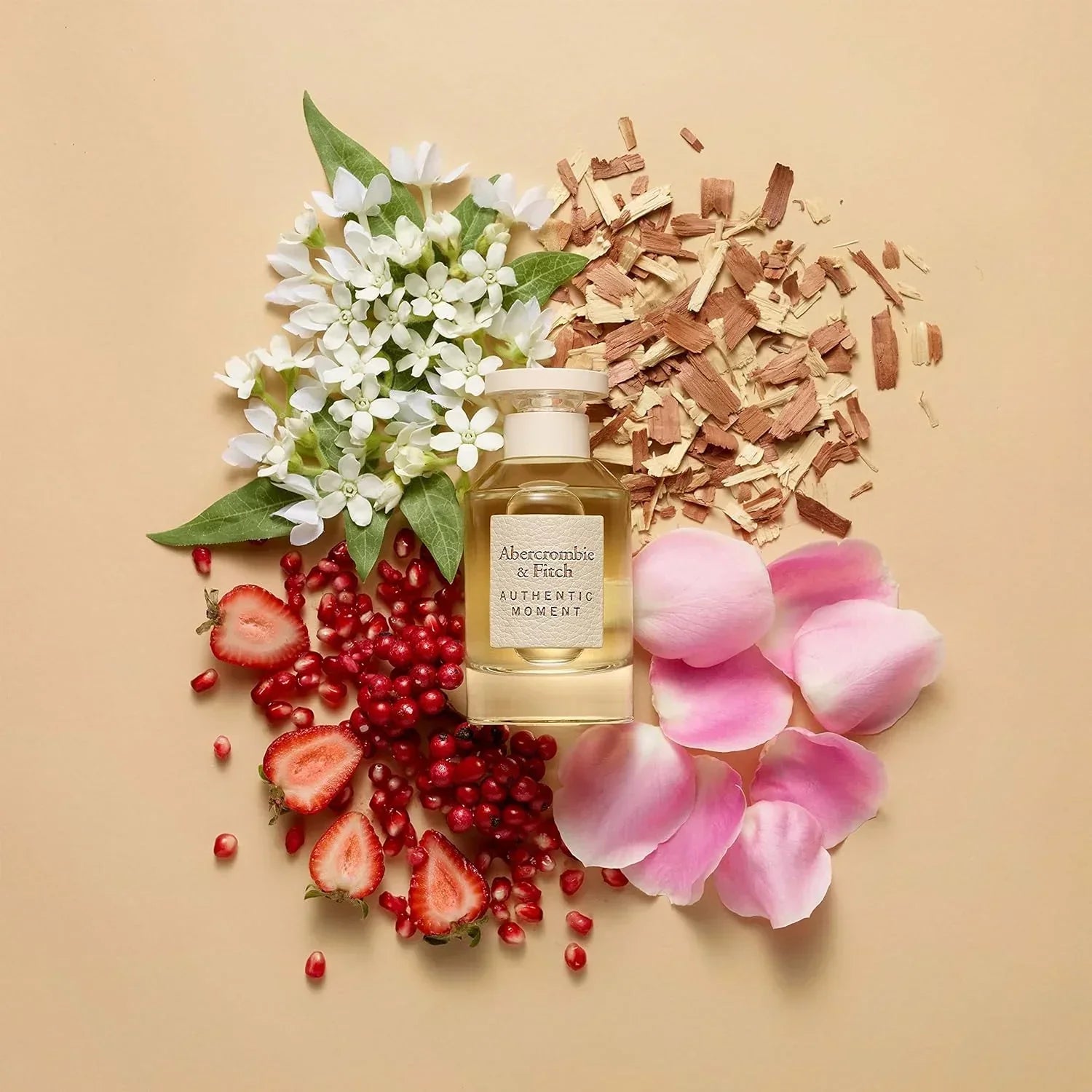 Abercrombie & Fitch Authentic Moment Eau de Parfum bottle with flowers, berries and wood chips