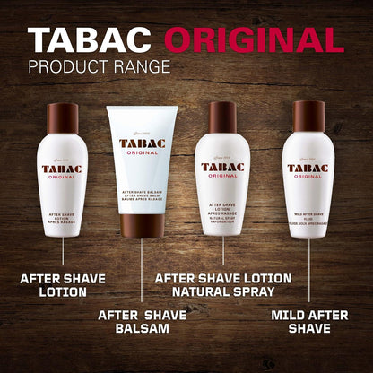 Four Tabac Original grooming products arranged on a dark wood background with labels underneath: after shave lotion, after shave balsam, after shave lotion natural spray, and mild after shave. The products are white bottles and tube with brown caps and brown lower sections, and large text at the top reads TABAC ORIGINAL PRODUCT RANGE.