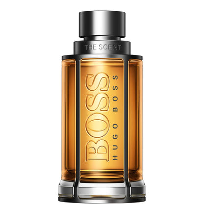 Hugo Boss The Scent perfume bottle, featuring a rectangular amber glass body with a metallic silver cap and base, set against a plain white background. 100ml